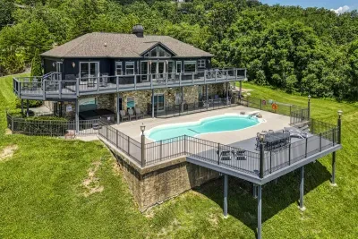 Pool on one level, hot tub on the next — mountains from both