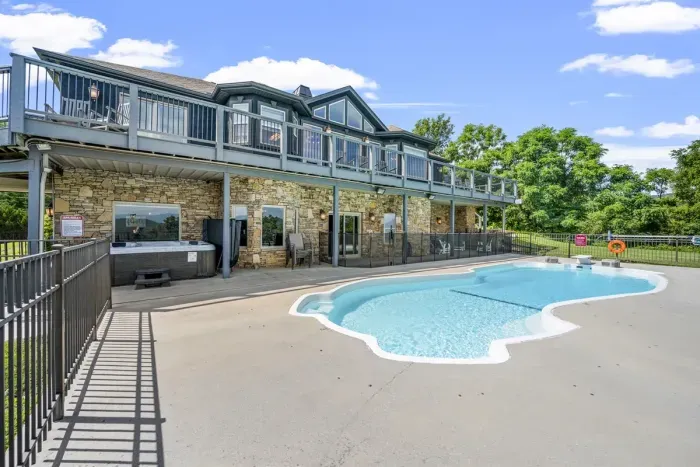 Lower level opens straight onto the pool and stone patio