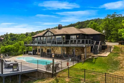 Pool, hot tub, and two decks all facing the same ridge