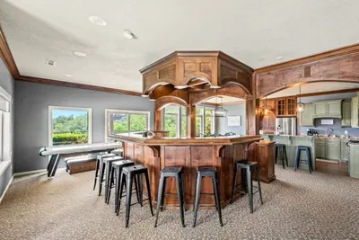 Handcrafted wood bar with stools all the way around
