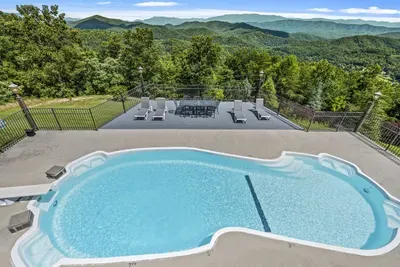 Saltwater pool with mountains filling the whole horizon