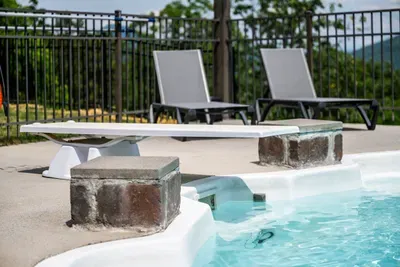 Shallow tanning ledge in stacked stone, sun-warm all day