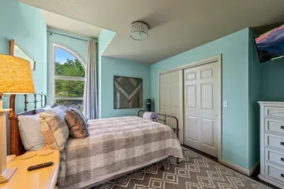 Guest room with its own TV and a dresser to unpack into
