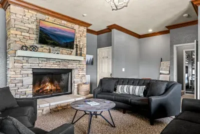 Floor-to-ceiling stone and a heavy wood mantel