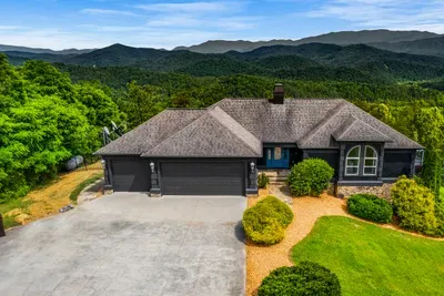 Level parking, three-car garage, mountains at your back