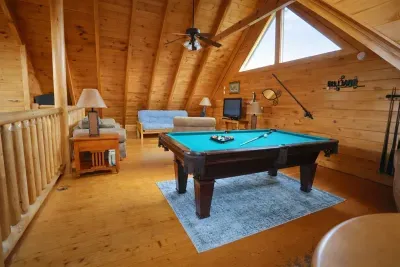 Billiards for fun, comfy couch for chill—upstairs living done right.