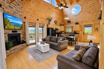 High ceilings, warm fireplace, and a comfy leather couch—perfect for family nights of movies and memories.