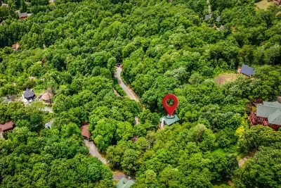 Privately nestled deep in the Blue Ridge forest — your cabin sits surrounded by acres of hardwood canopy with no neighbors in sight. Pure mountain escape.
