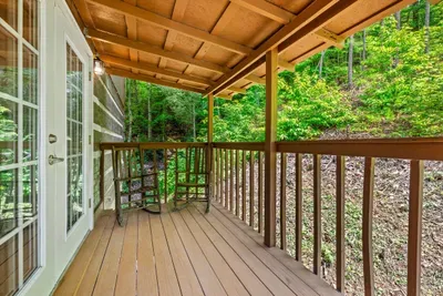 Step through the French doors to a private covered balcony hovering over the forest — coffee in hand, birdsong all around, the trees close enough to touch. Your own quiet perch.