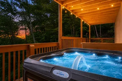 Sink into the bubbling hot tub with a wall of forest as your only view — steam rising, jets humming, not a neighbor in sight. The soak guests rank as the favorite part of the stay.