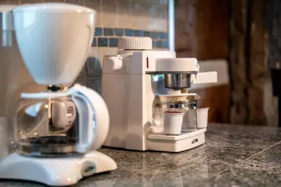 Wake up to a stocked coffee station — drip brewer and espresso maker ready before the trail calls. The first cup always tastes better poured right here in the cabin.