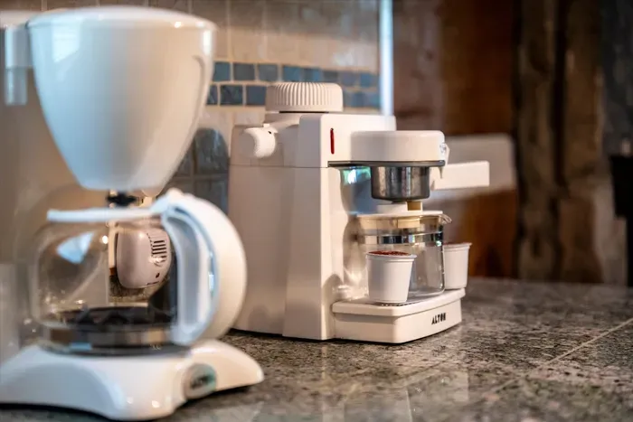 Wake up to a stocked coffee station — drip brewer and espresso maker ready before the trail calls. The first cup always tastes better poured right here in the cabin.