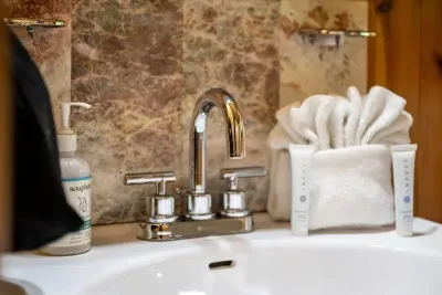 Folded towels, fresh soap, and a tidy sink ready on arrival — the hosted touches that tell you the place was prepped with care. Show up and simply relax.