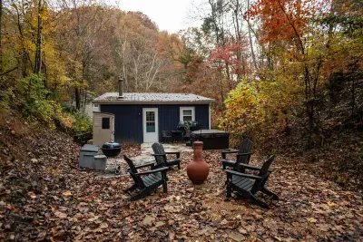 October at the cabin: leaves down, chiminea lit, chairs circled, sweater weather doing its thing. The quietest, sharpest season on this hillside.