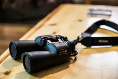 Binoculars on the table, ready when you are. Warblers in the morning, deer at the edge of the clearing at dusk — the wildlife shows up if you sit still long enough.