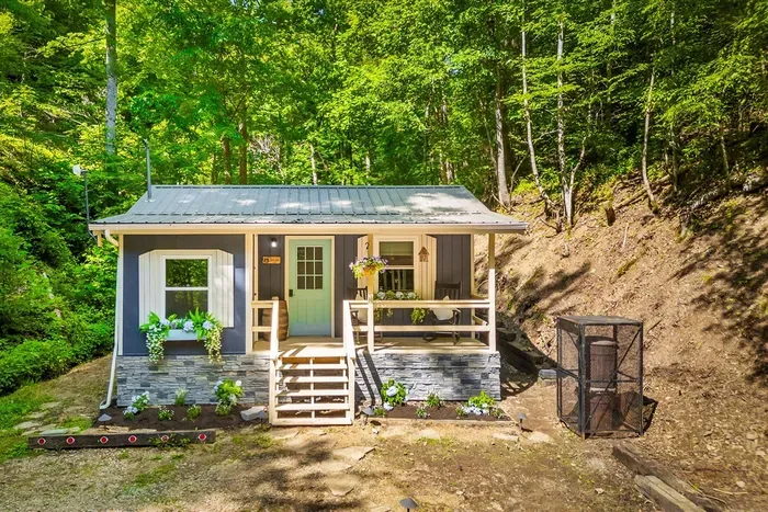 Your own cabin tucked into the hillside, porch lights on and no one else in sight. Park, climb the steps, and feel the week fall away before you've even opened the door.