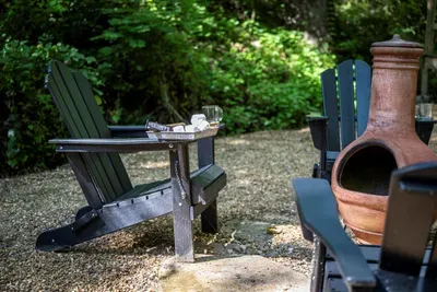 Coffee by the chiminea before anyone else is up. Cool air, bird noise, and a fire that takes about a minute to catch. Mornings out here are the reason to come.