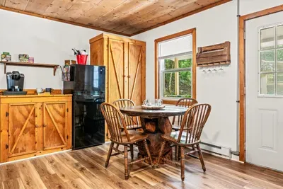 Keurig ready before you are, table by the window, woods filling the glass. Pour a cup, sit down, and watch the mist lift off the ridge while everyone else sleeps.