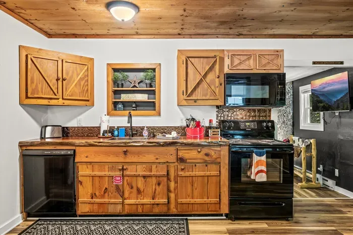 Counter space that doesn't run out mid-recipe, with the good cookware in the drawers below. Cook like you're home, then take your plate out to the fire.