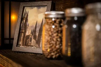 A castle print, glass jars of sweets, and lantern light along a pine shelf — the themed corners here reward a slow look. Every surface hides something worth finding.