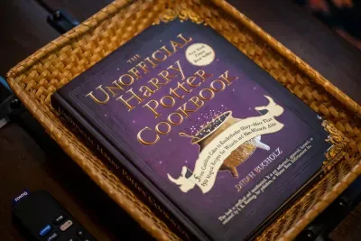 A themed cookbook left out on the counter — spend a rainy morning cooking something enchanted with the kids. The details here go well past what's hanging on the walls.