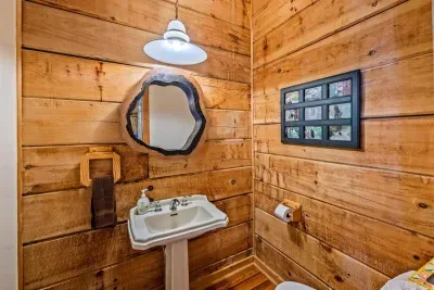 The private half-bath features a toilet.
