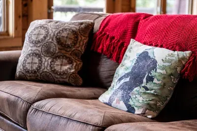 The perfect spot to unwind 🏔️ – curl up with a blanket, enjoy the mountain air through the windows, and let your stress melt away.