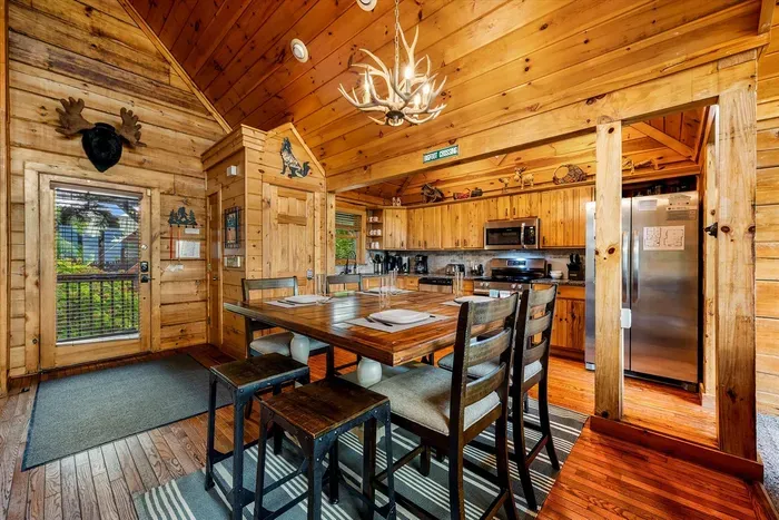 Dining room with seating for 8 guests, plus a highchair for a child