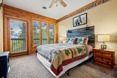 Settle into this serene bedroom with a plush queen bed.