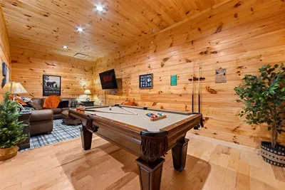 Smart TV, comfy sofa, and a pool table — who says you need to go out to have fun?