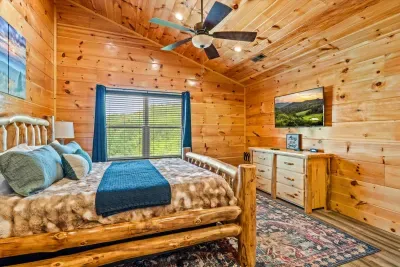 Log bed with a window full of green out back