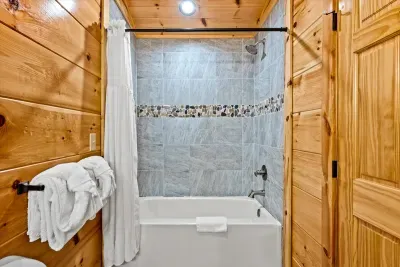 Tub-shower with towels stacked and waiting