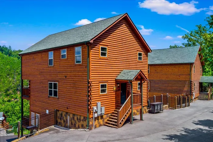 Three stories of log cabin with parking right out front