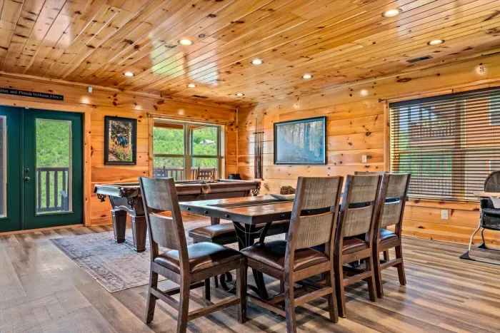 Dining table that seats eight under log-beam ceilings