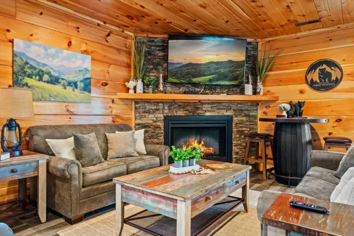 Stacked-stone fireplace with lanterns on the mantel