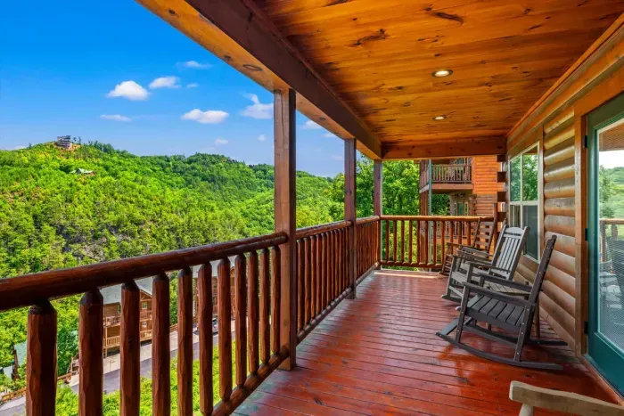 Rocking chairs and a wall of green off the covered porch