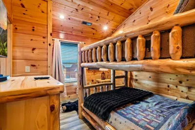 Log bunk beds made up with bear-print quilts