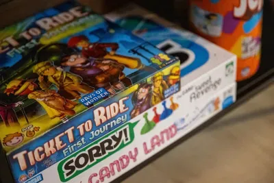 Game night's already stocked — shelves of classics ready for the whole crew. Rainy afternoons and after-dinner rematches sort themselves out here.