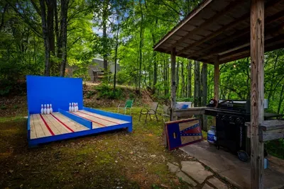 Enjoy a unique outdoor bowling experience with family and friends—perfect for friendly competition and unforgettable cabin memories.