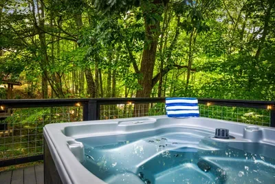 Sink into the private hot tub as the forest hums around you — bubbling jets, canopy views, zero cell reception required. Guests' most-requested way to end the day. Can you feel it already?