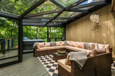 Sink into the screened-porch sectional as filtered light and forest quiet do their thing. Guests' favorite spot to lose a lazy afternoon.
