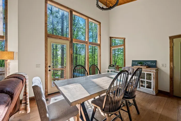 Dining table seats 6, with additional bar stools for extra seating.