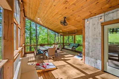 Deck includes comfortable seating in a peaceful setting.