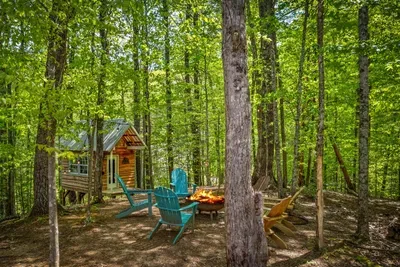 Unwind in Adirondack chairs while the little ones enjoy their own cabin.