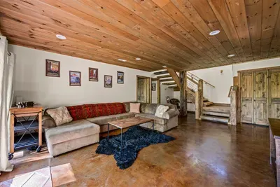 Open concept living room with electric fireplace and TV with Firestick--bring your own passwords!