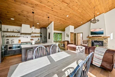 Fully equipped kitchen has view of dining area and living room.