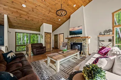 Open concept living room includes electric fire place and TV with Firestick--bring your own passwords!