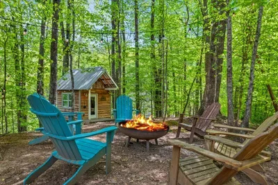 Smoky Mountain nights made perfect: fire pit, forest views, and a magical playhouse for little adventurers.