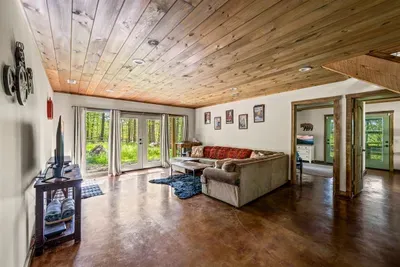 Open concept living room with electric fireplace and TV with Firestick--bring your own passwords!