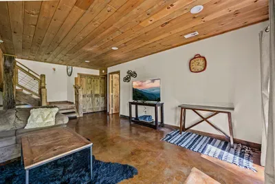 Open concept living room with electric fireplace and TV with Firestick--bring your own passwords!